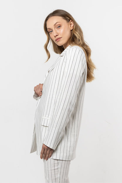 Close-up of the soft linen texture and delicate stripes of the awama blazer, exemplifying luxury and comfort.