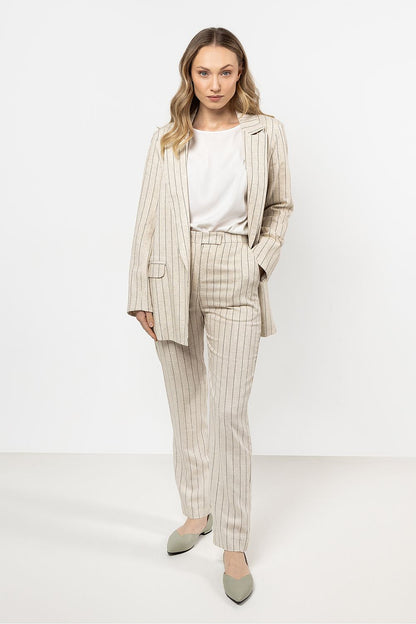 Luxurious summer outfit combining Awama's striped linen cigarette trousers with a matching vest, ideal for casual or formal events.