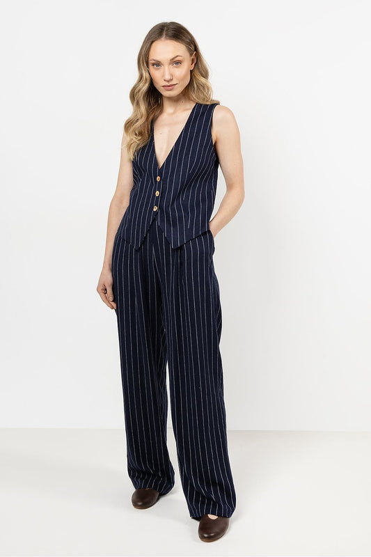 Elegant linen trousers by Awama featuring wide legs and thin stripes, available in sizes S to XL, perfect for a sophisticated summer look.