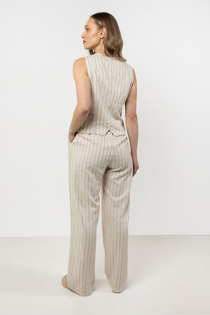 Elegant linen trousers by awama featuring stylish wide legs with delicate stripes, perfect for a luxurious summer outfit.