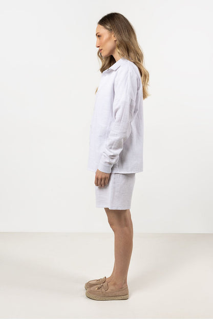 Elegant long sleeve Awama cotton shirt for women in soft white, featuring a contemporary stand-up collar and hidden button placket, perfect for luxurious everyday wear.