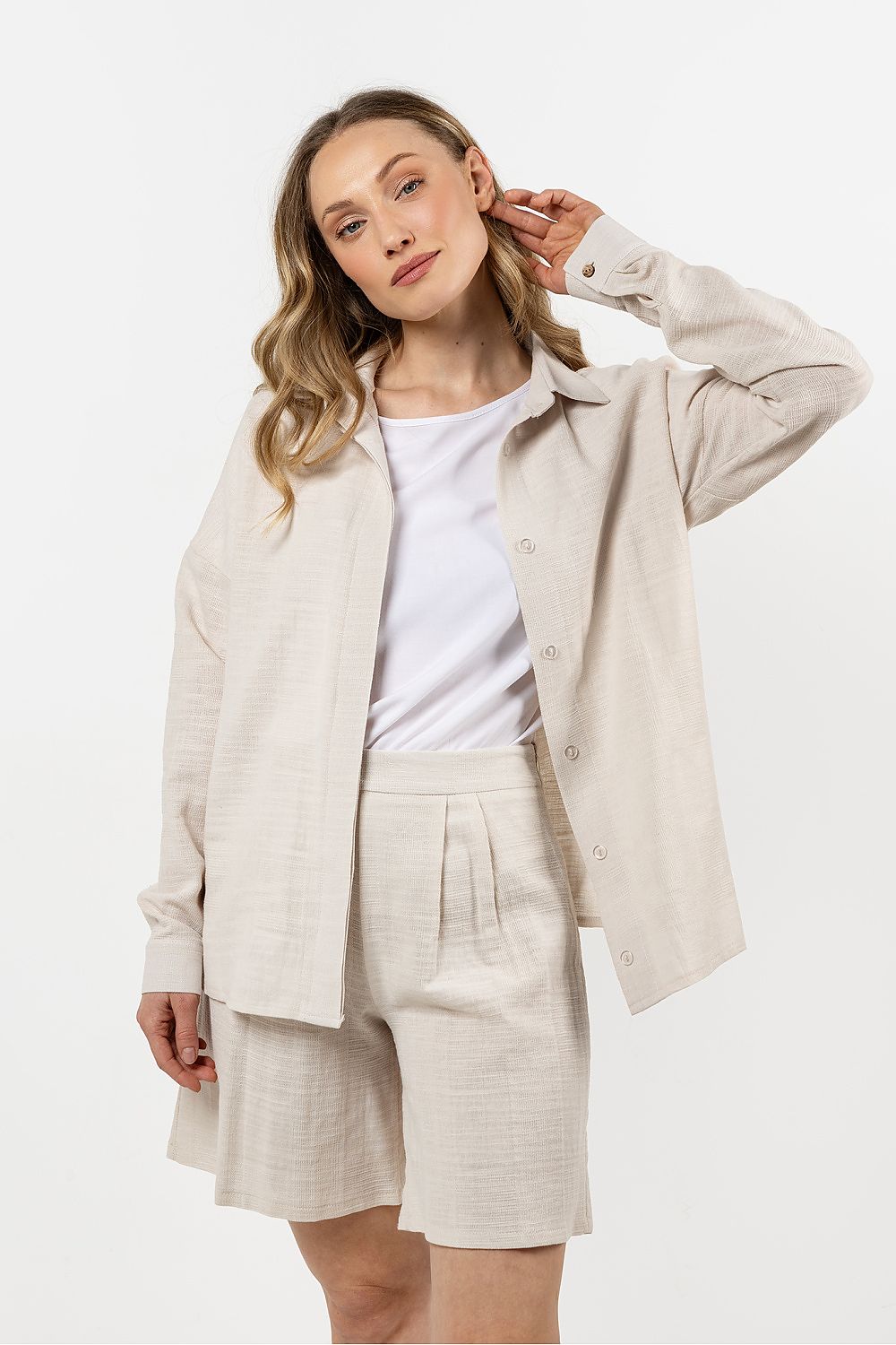 Elegant long sleeve Awama cotton shirt for women in a chic black colour, featuring a stand-up collar and hidden buttons for a modern touch, perfect for versatile fashion choices.