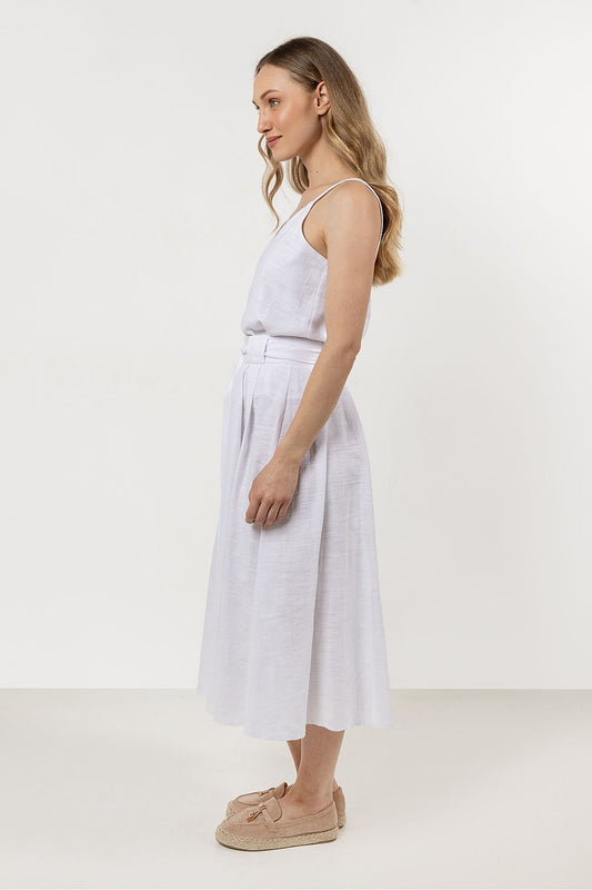 Luxurious cotton fabric of the Awama flared skirt, showcasing its soft texture and pleated design.