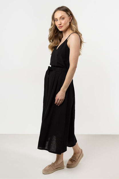 Models elegantly displaying the Flared Skirt by Awama, highlighting its comfortable fit and stylish flared silhouette for every occasion.