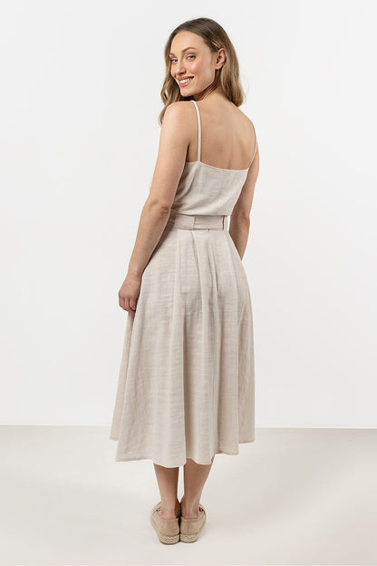Detailed view of the Awama flared skirt featuring a comfortable wide waistband, crafted from 100% natural cotton, ideal for a chic summer outfit.
