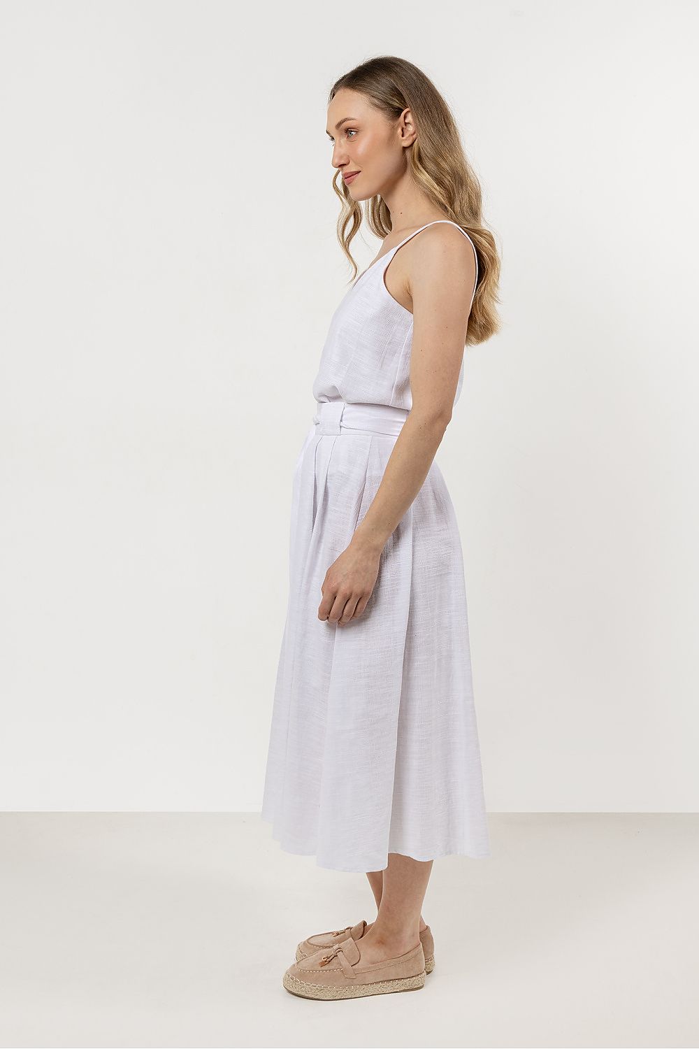 Awama's minimalistic cotton top with delicate thin straps, crafted from 100% soft cotton for breathable comfort in warm weather.