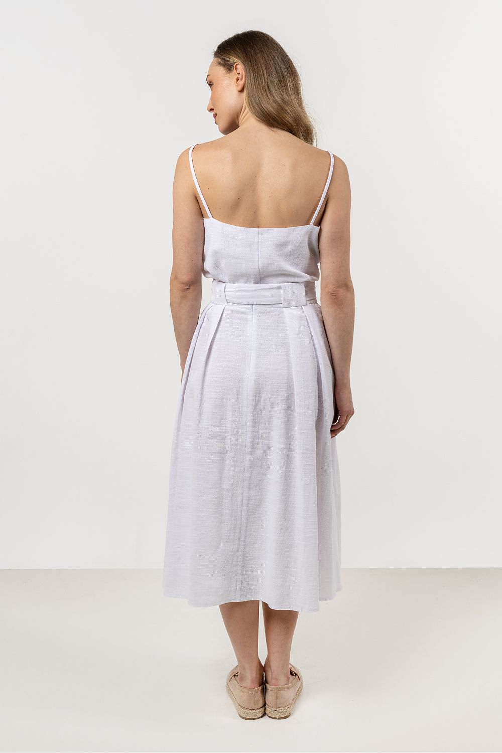 Chic hip-length cotton top by Awama, ideal for pairing with skirts or shorts, enhancing your summer wardrobe effortlessly.