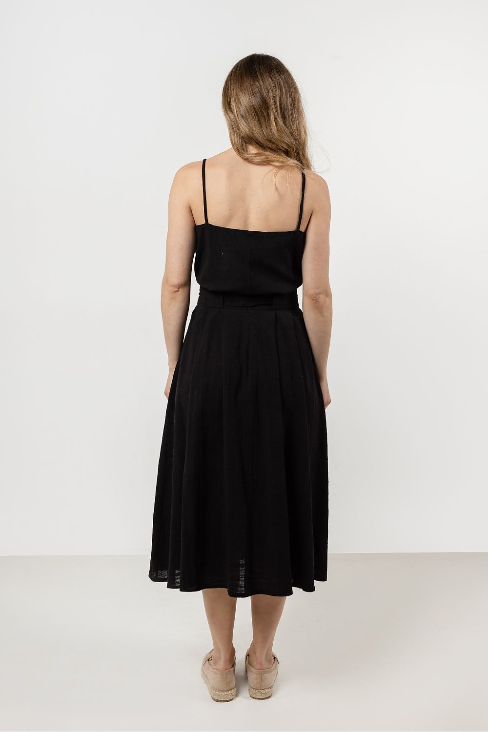 Model wearing the elegant cotton top by Awama, paired with stylish shorts for a chic summer look.