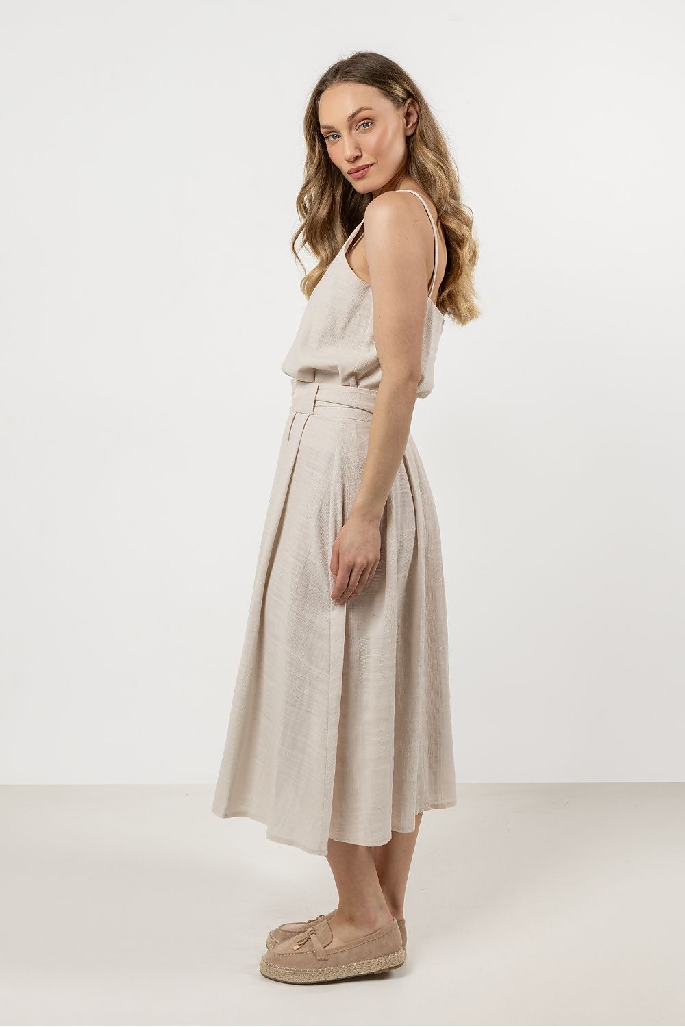 A range of sizes of the elegant cotton top by Awama displayed, perfect for curating a fashionable summer wardrobe.