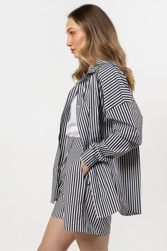 Close-up detail of the Awama luxury cotton shirt's buttons and cuffs, highlighting the elegant design and premium fabric.