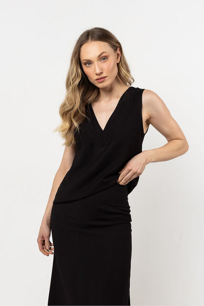 Luxurious fabric of Awama's V-Neck Blouse highlighting the elegant design and comfortable styling for chic outfits.