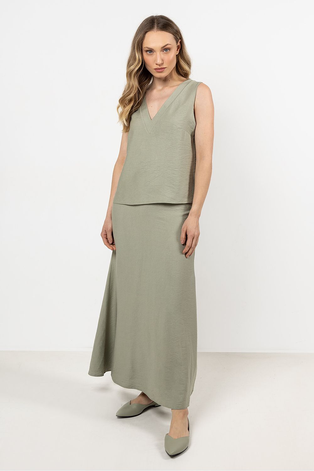 Elegant flared long rayon skirt with a stylish slit, by Awama, showcasing a flattering silhouette for luxury styling.