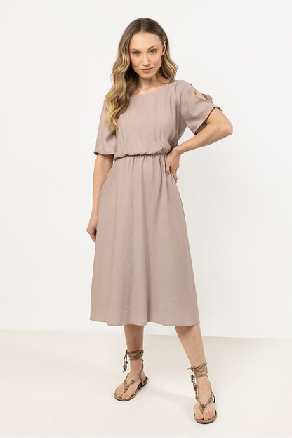 Model wearing the Awama daydress, exuding elegance and grace, perfect for both casual outings and special events.