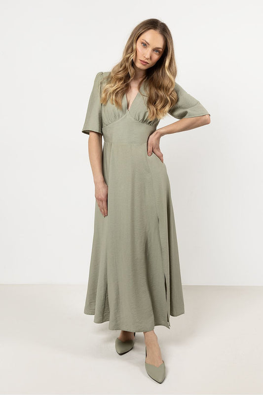 Awama elegant daydress showcasing a V-neck design with belted waist and stylish slit, crafted from soft rayon for ultimate comfort.