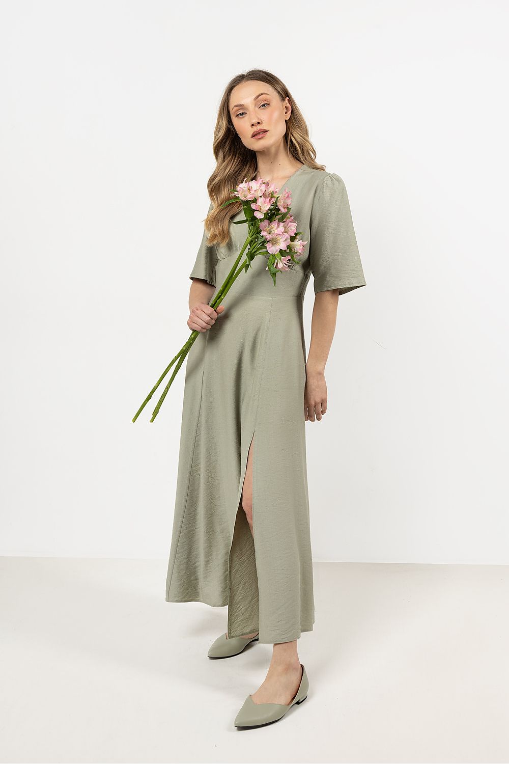 Close-up view of the Awama elegant daydress highlighting delicate bust gathering and luxurious fabric texture.