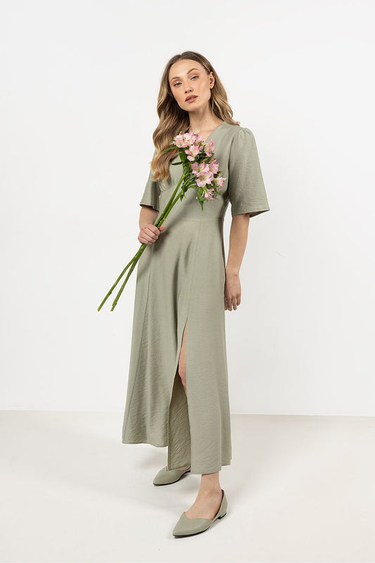 Close-up view of the Awama elegant daydress highlighting delicate bust gathering and luxurious fabric texture.