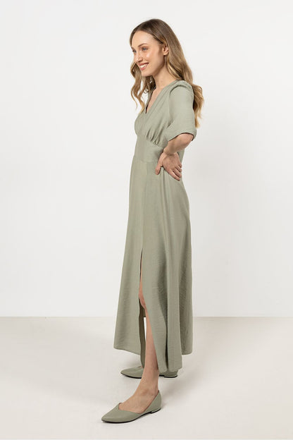 Full body view of an Awama elegant daydress worn, featuring classic silhouette and graceful slit, perfect for any occasion.