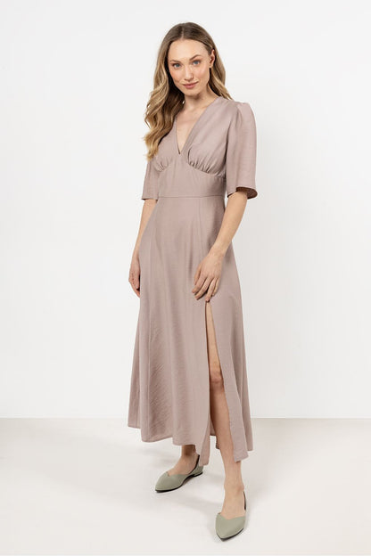 Awama Elegant Daydress in soft rayon featuring a V-neck and belted waist, showcasing feminine charm and classic style.