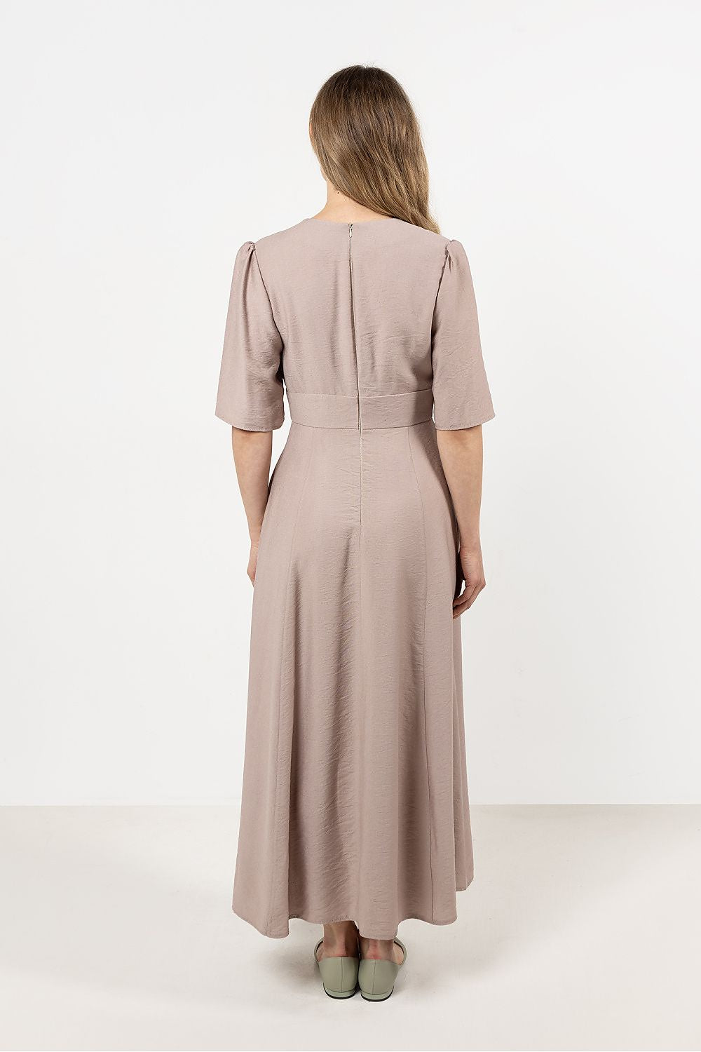 Awama Daydress displayed on a model, highlighting the flattering fitted cut and waist-defining belt, perfect for luxurious comfort.