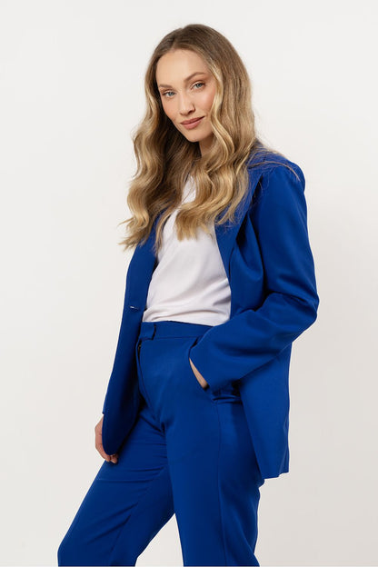 Stylish detail of women's fitted blazer from Awama, showcasing elegant pocket flaps and high-quality lining, ideal for chic office wear.