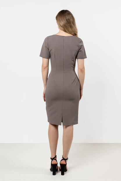 Back view of the Elegant Asymmetrical Hem Pencil Dress by Awama, showcasing the hidden zipper and back slit for added comfort and style.