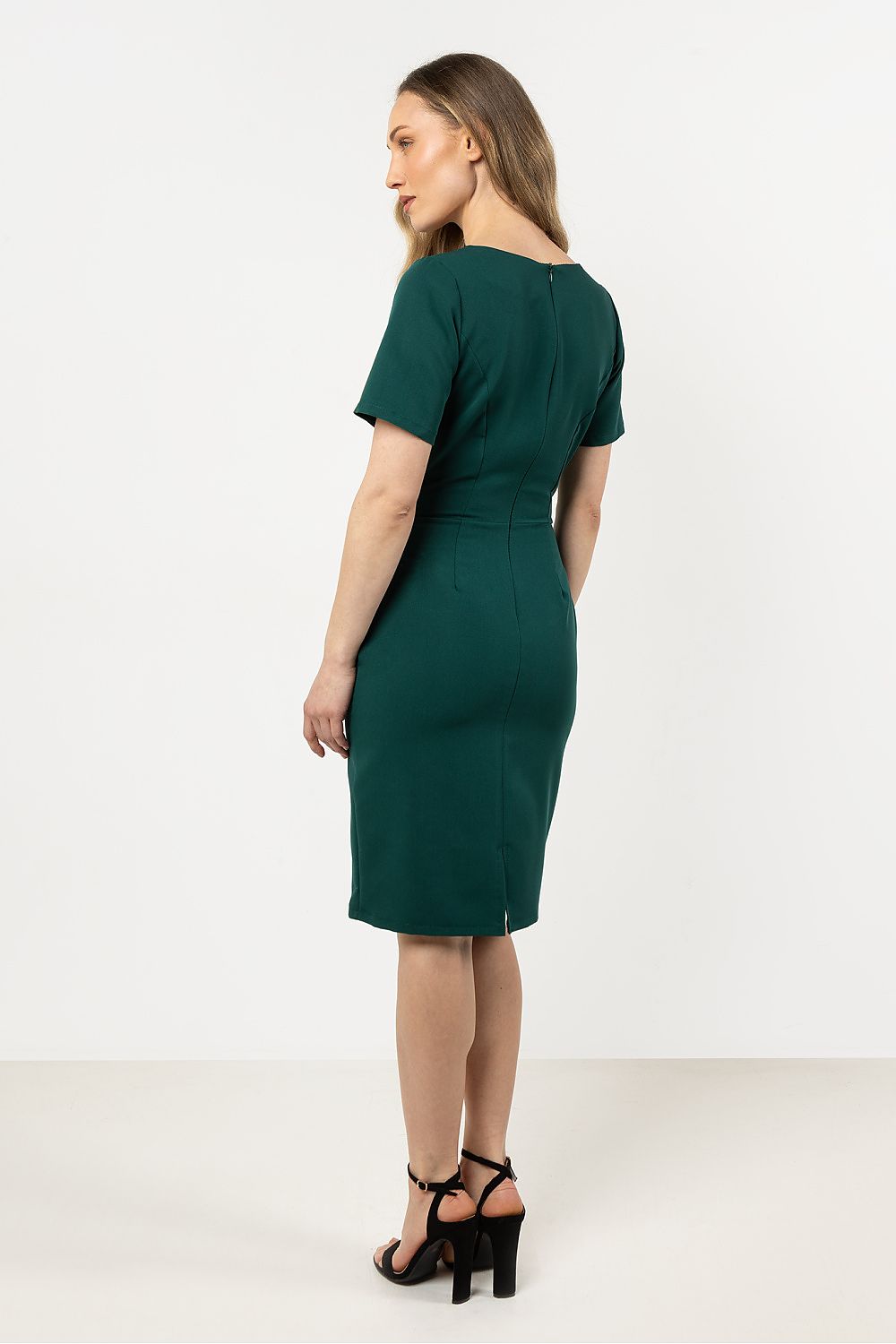 Elegant asymmetrical hem pencil dress by Awama, showcasing its fitted silhouette and unique hem detail, perfect for any occasion.