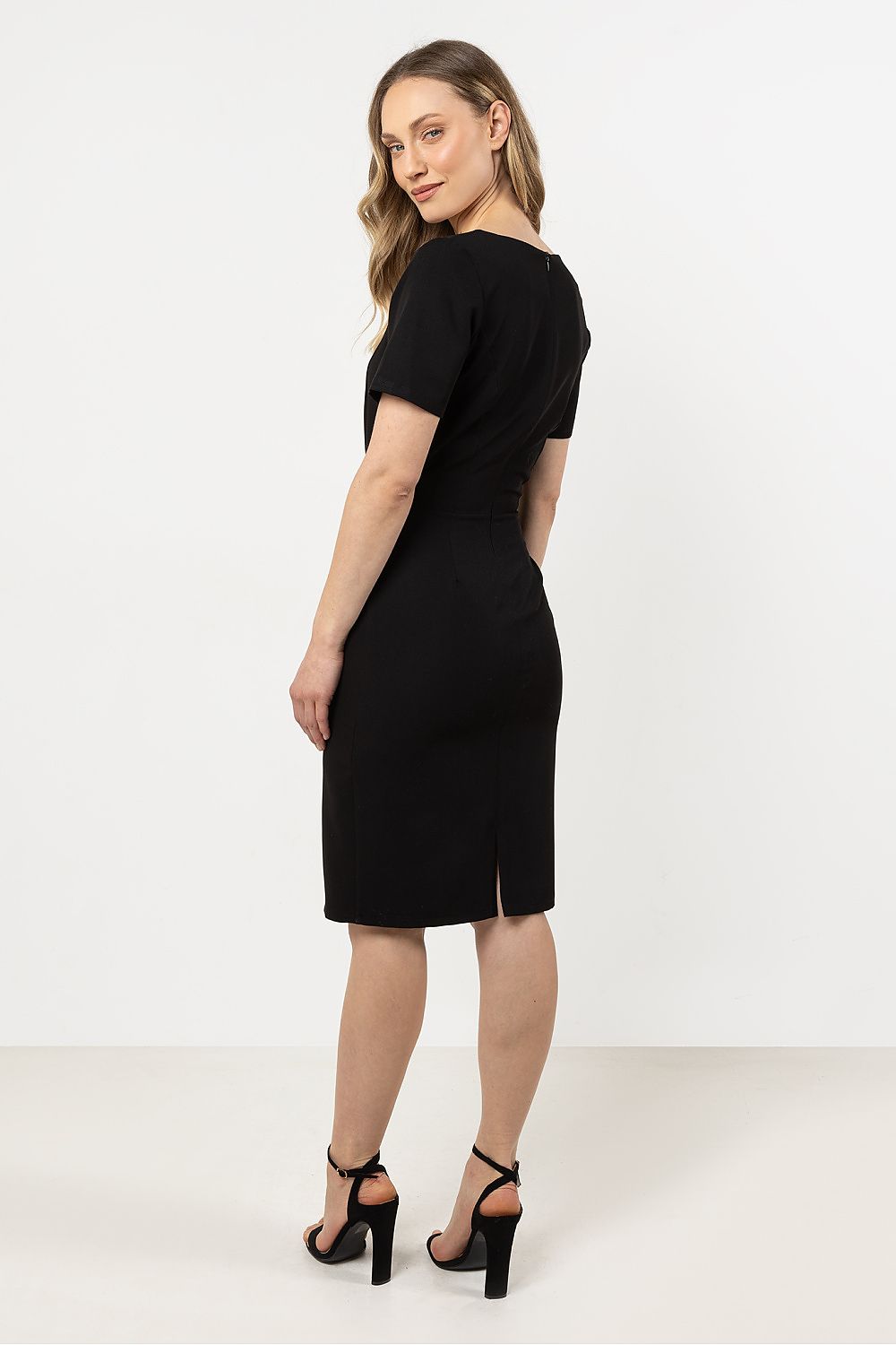 Model showcasing the stunning Awama asymmetrical hem pencil dress, perfect for formal and casual events alike.