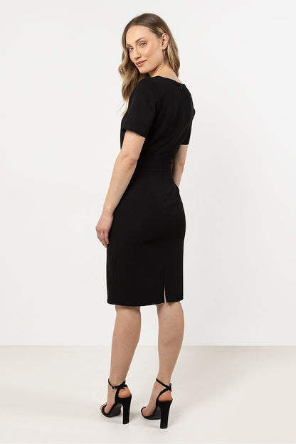 Model showcasing the stunning Awama asymmetrical hem pencil dress, perfect for formal and casual events alike.