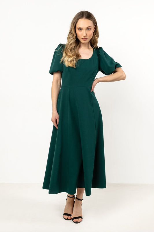 Elegant Awama Daydress featuring a deep neckline, flared bottom, and side slit, designed for luxury and comfort, available in sizes S to XL.