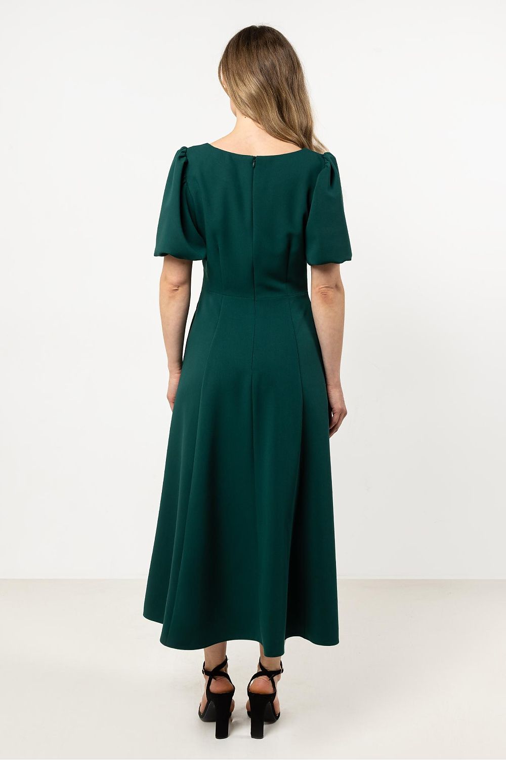 Awama Daydress in a close-up view highlighting the fitted top and short gathered sleeves with elastic bands for a refined look.