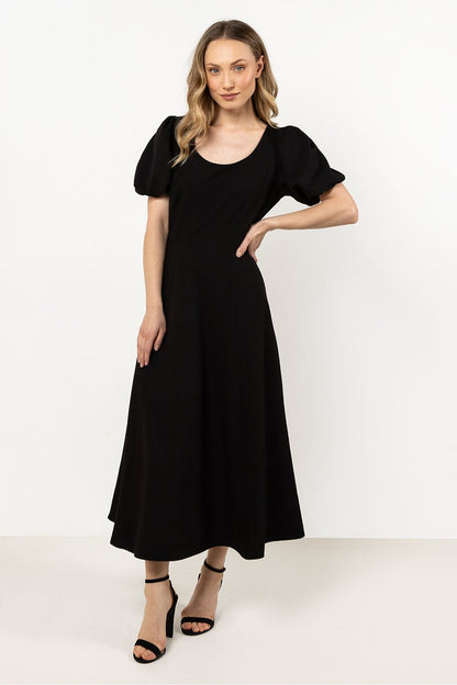 Elegant Awama Daydress with deep neckline and flared bottom, showcasing sophisticated style for any occasion.
