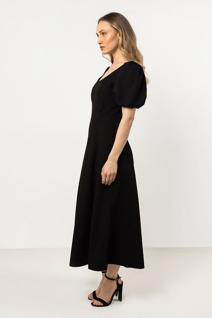 Luxury Awama dress featuring a modern side slit and flattering silhouette, perfect for day or evening wear.