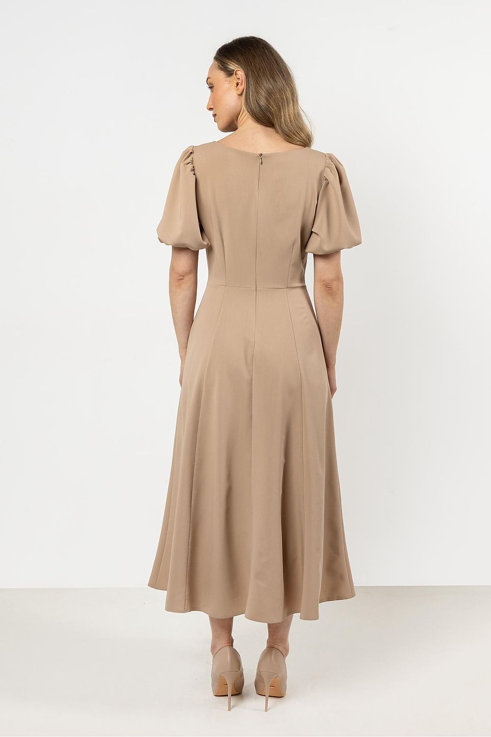 Versatile Awama Daydress illustrating modern fashion with a deep neckline, making it the ideal choice for sophisticated events.