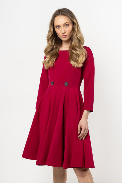 Model wearing the Awama Elegant Flared Daydress in a stylish pose, exemplifying its versatile design for both casual and formal settings.