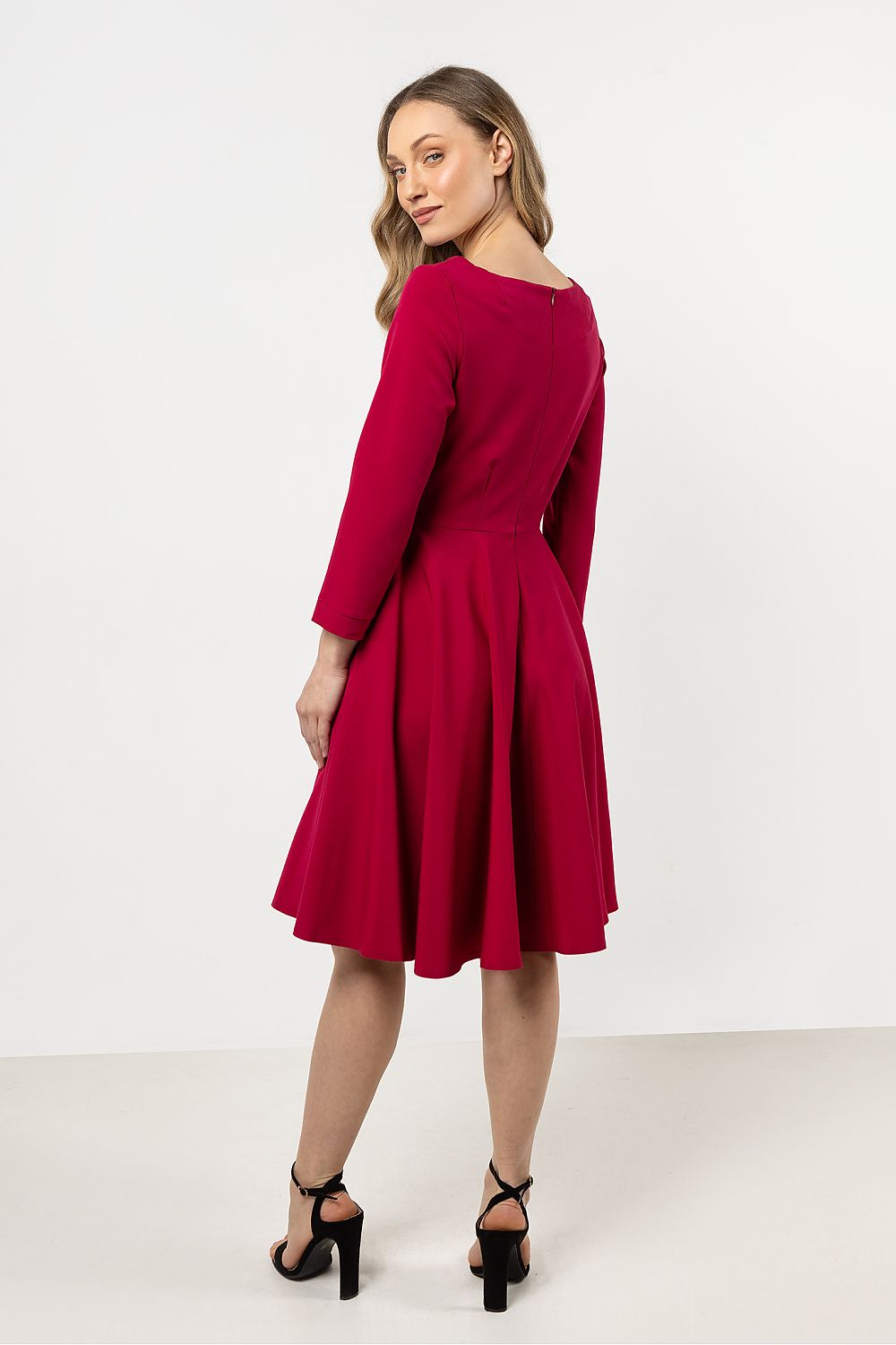 Elegant Flared Daydress by Awama showcasing a sophisticated boat neckline and decorative buttons, perfect for stylish occasions.