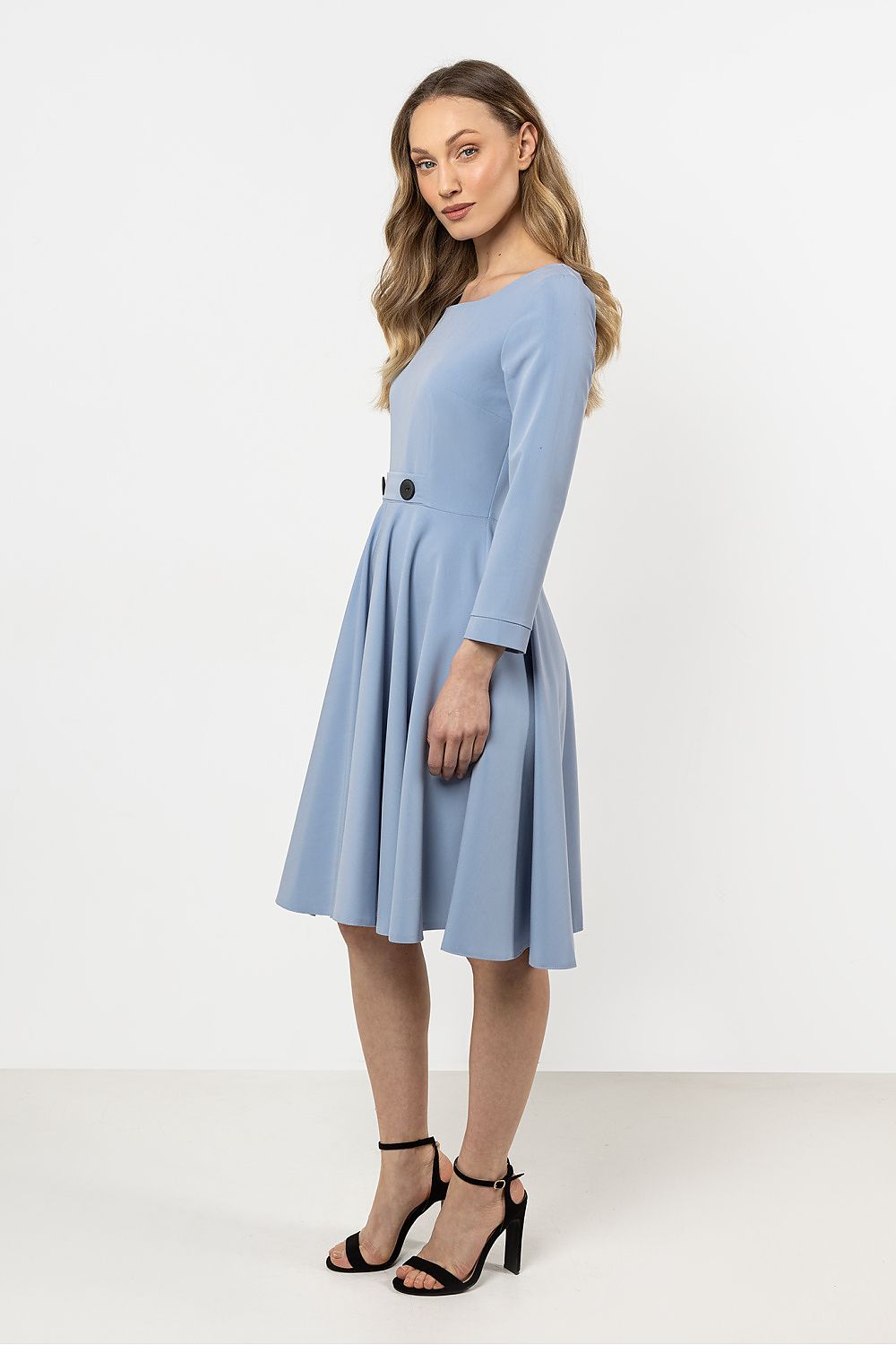 Close-up of Awama's elegant flared daydress showcasing the intricate decorative buttons and premium fabric quality for a fashionable statement.