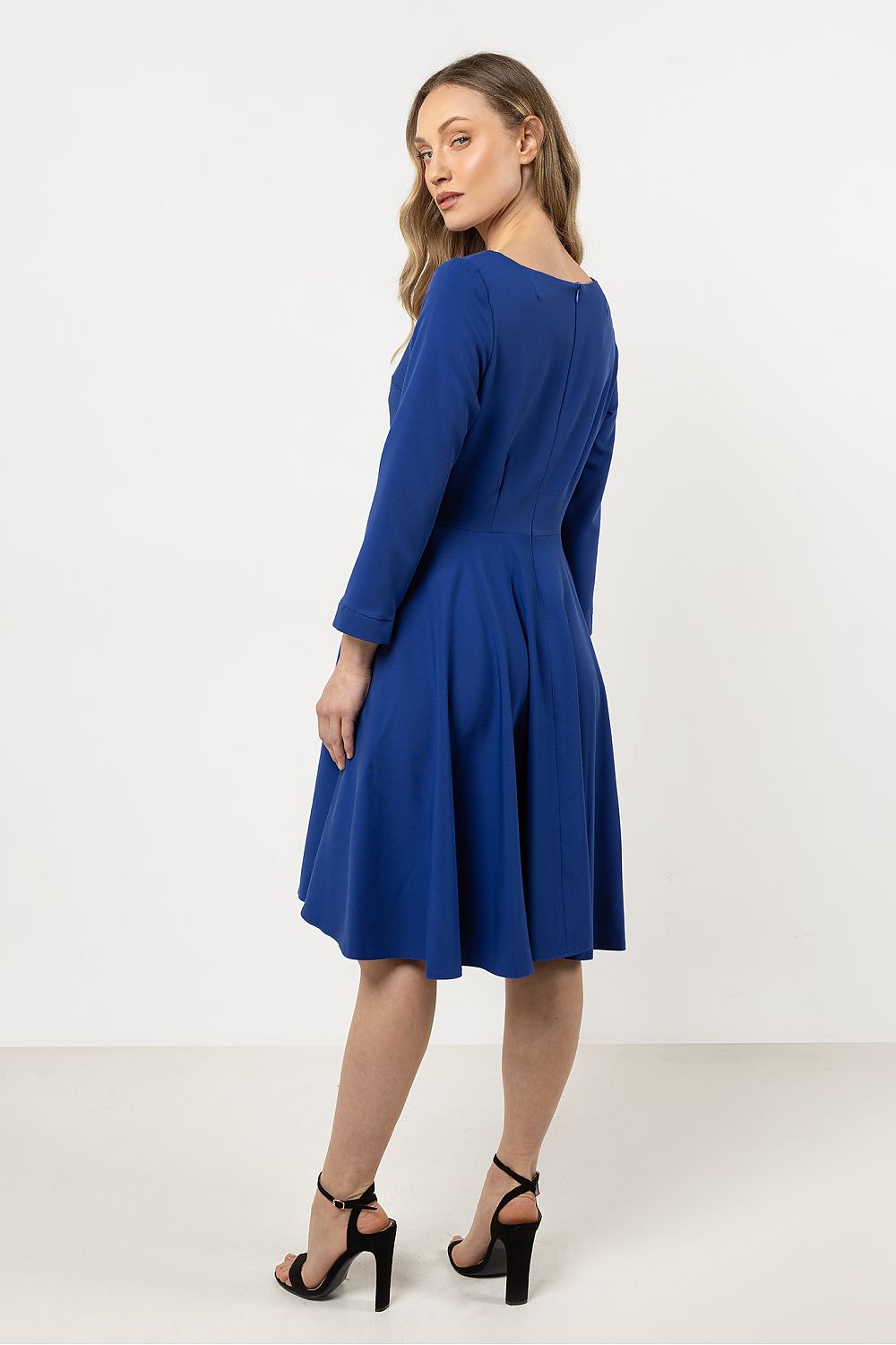 Elegant Flared Daydress by Awama with a concealed zipper at the back, emphasizing both style and practicality for luxurious occasions.