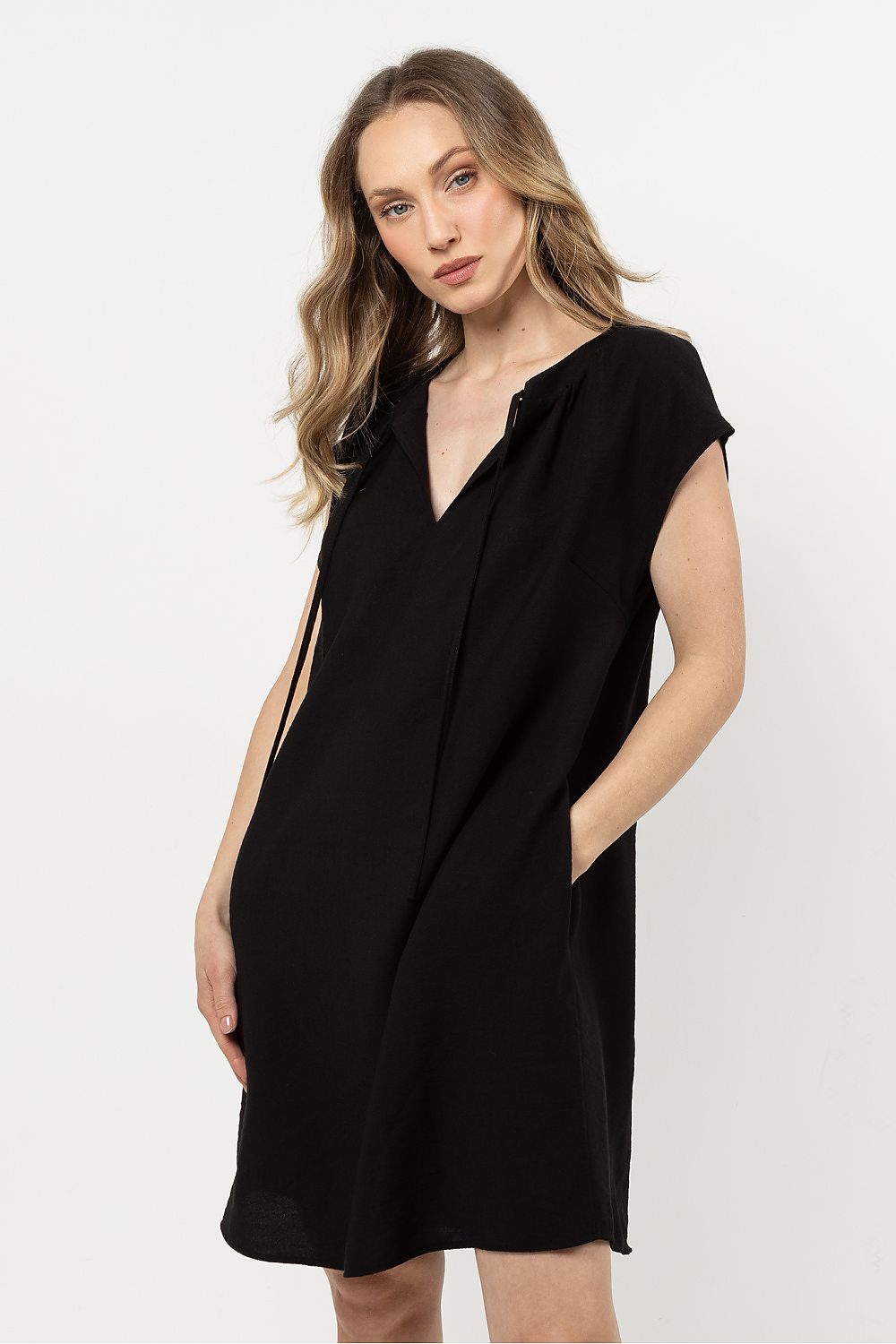 Elegant lightweight rayon daydress by Awama showcasing an adjustable neckline and stylish pockets, perfect for warm weather fashion.