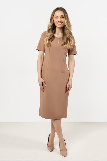 Awama's elegant daydress displayed in a chic setting, ideal for day or evening wear with its versatile design.