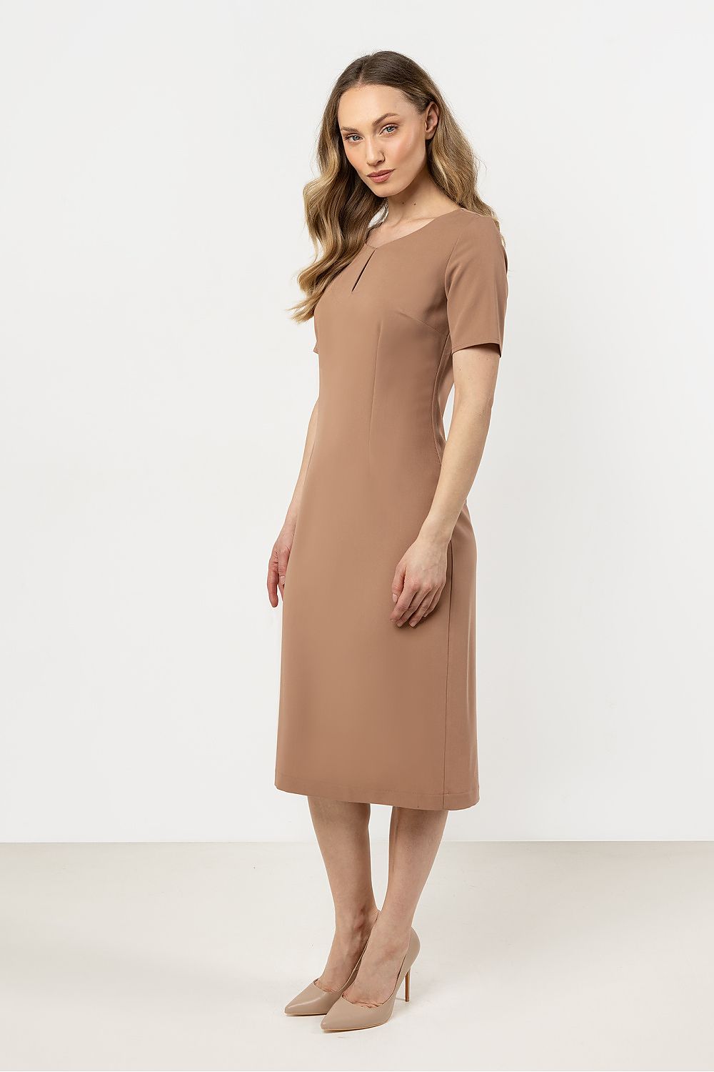 Elegant daydress by Awama highlighting the concealed zipper and fitted cut, perfect for a polished look.