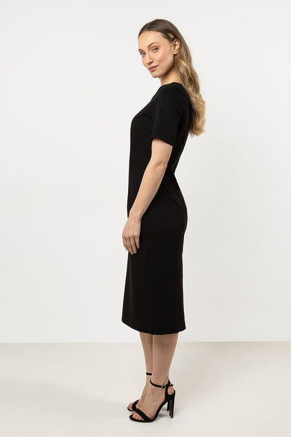 Elegant fitted daydress by Awama crafted with a boat neckline and short sleeves, showcasing a sophisticated silhouette for versatile dressing, perfect for both casual and elegant occasions.