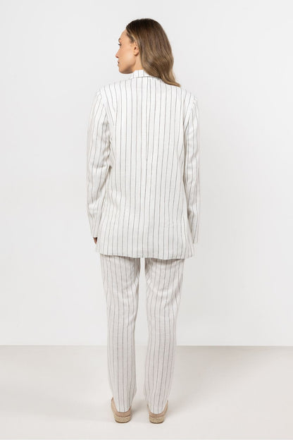 Size chart for awama's elegant striped linen cigarette trousers for women, detailing EU and US sizes for an accurate fit.