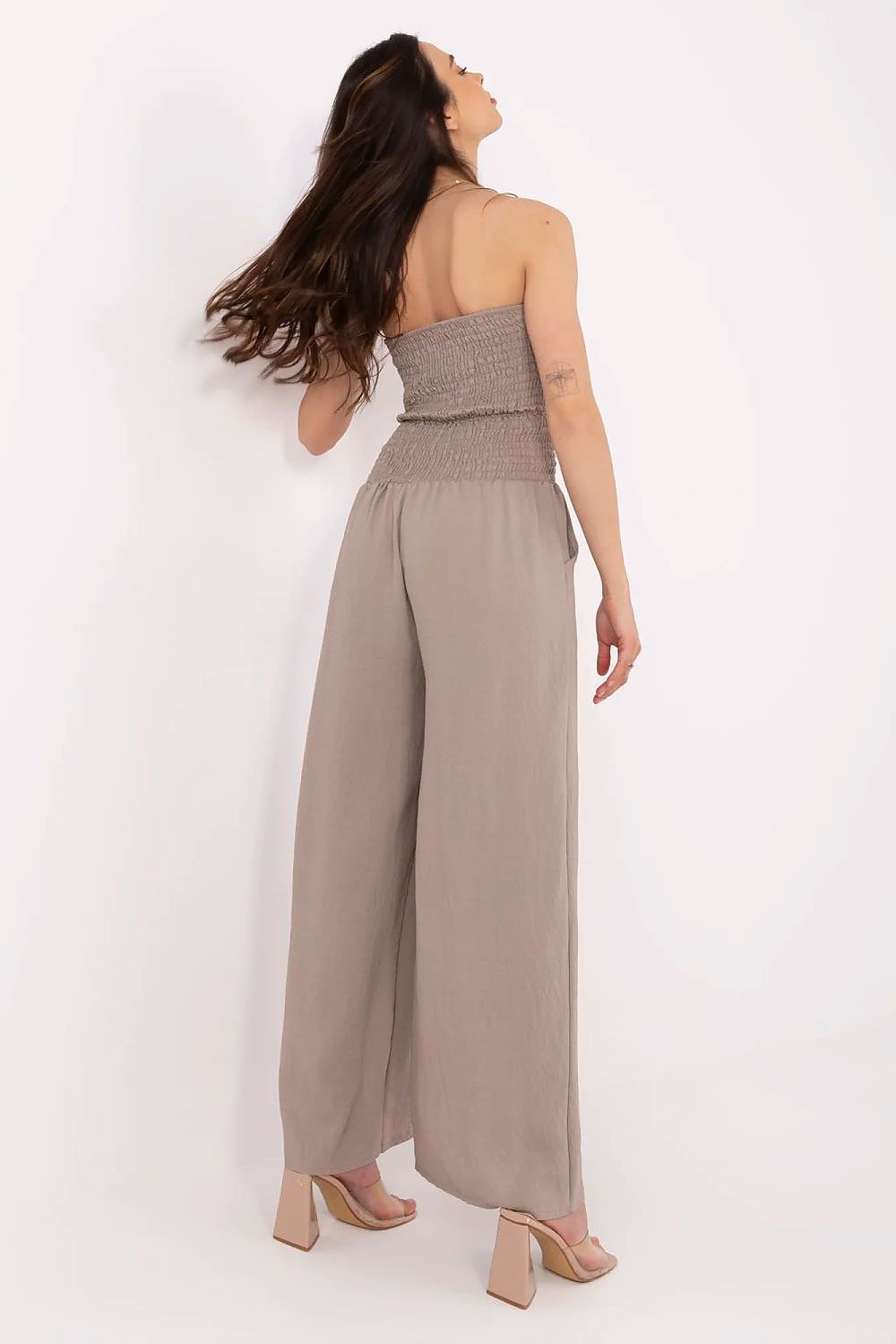 Italy Moda luxury jumpsuit with side pockets and a modern Spanish neckline, perfect for casual styling.