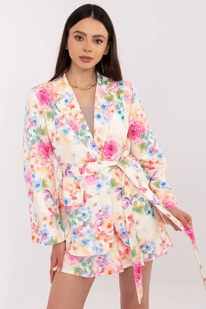 Model wearing Italy Moda's elegant women's blazer and shorts set, demonstrating its tailored fit and the chic silhouette it creates.