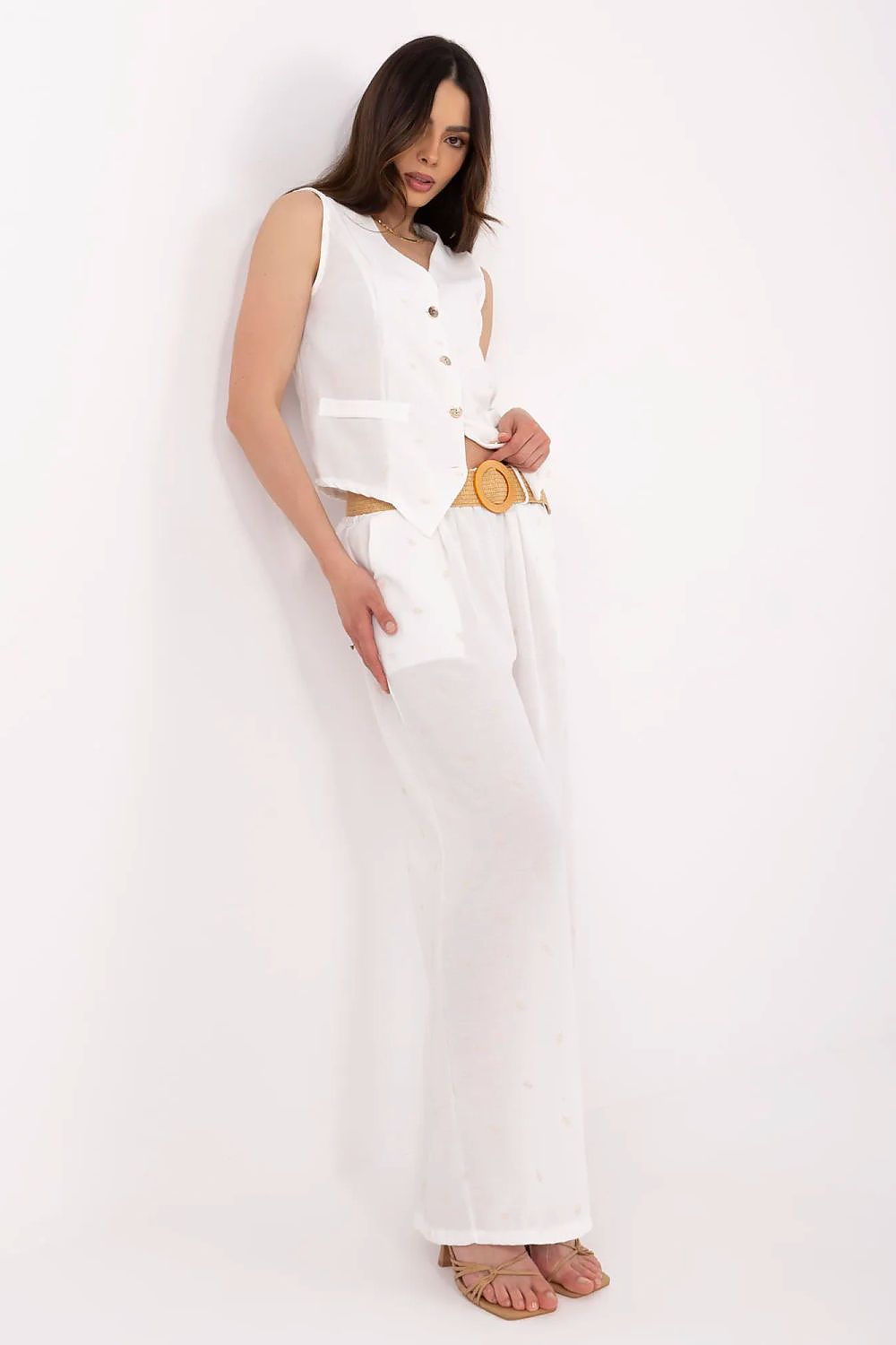 Stylish close-up of the elegant V-neck vest from Italy Moda's women's 2-piece set, highlighting its button detail and fine embroidery.