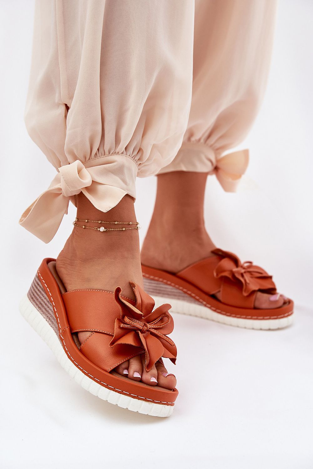 Luxury women's natural leather wedge flip-flops by Step in Style featuring elegant flower detail and comfortable sole, perfect for summer wear.