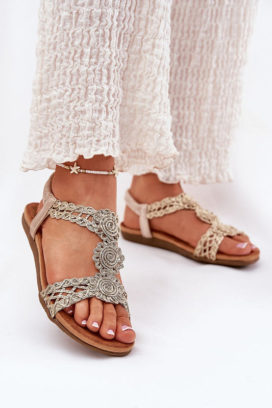 Elegant flat women's sandals featuring braided straps, designed for comfort by Step in style, perfect for summer.