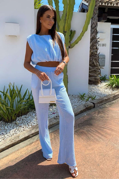 Elegant outdoor setting featuring LaBalancia Women's muslin set, emphasizing the breathable material and chic silhouette.