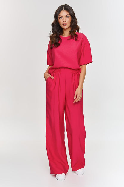 Wide angle of the Makadamia 2-Piece Set featuring a loose-fitting blouse and wide leg trousers, perfect for chic business meetings or elegant social gatherings.