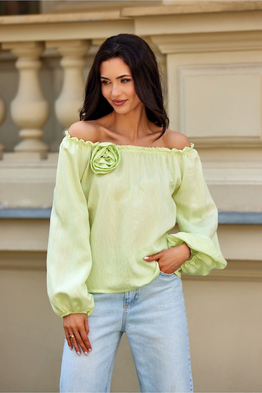 Elegant Roco Fashion blouse displayed on model showcasing adjustable neckline and puffy sleeves, perfect for stylish spring outfits.